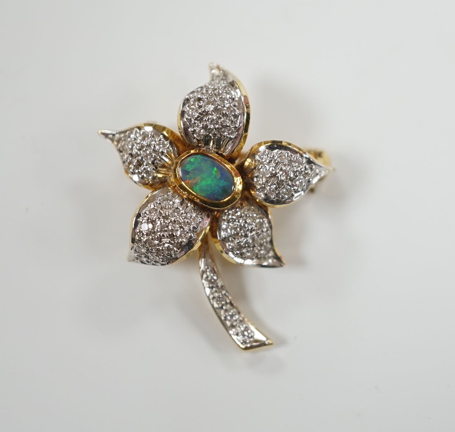 A modern 750 yellow metal, opal doublet? and diamond chip set flower brooch, 31mm, gross weight 7.3 grams.